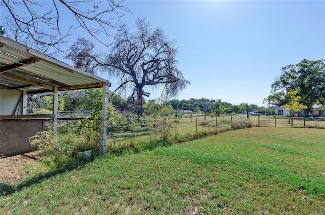 view of yard with a rural view