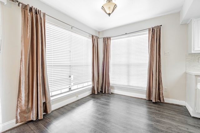 spare room featuring dark hardwood / wood-style floors