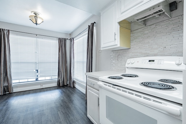 kitchen featuring backsplash, white range with electric cooktop, white cabinetry, dark wood-type flooring, and extractor fan