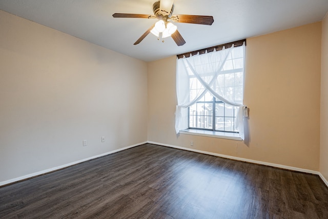 unfurnished room with dark hardwood / wood-style floors and ceiling fan