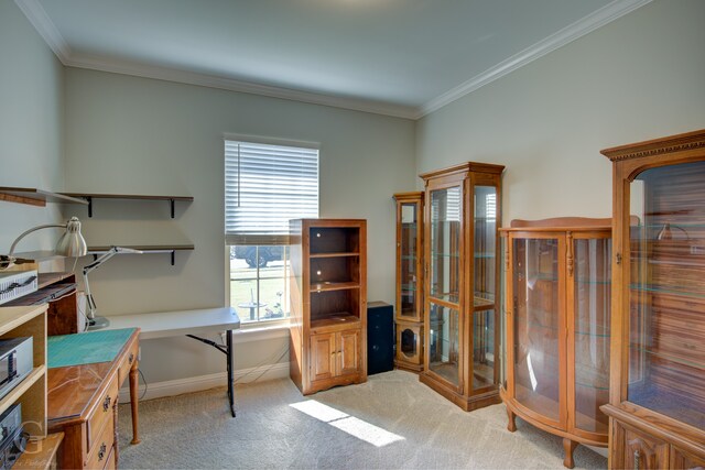 home office featuring ornamental molding and light carpet