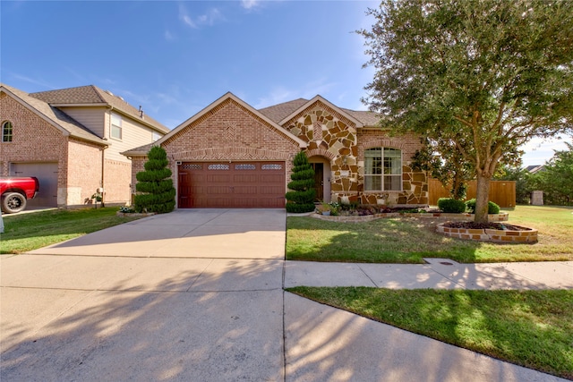 view of front facade with a front yard and a garage