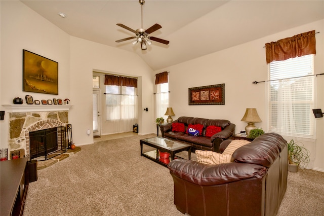 living room featuring lofted ceiling, light colored carpet, a healthy amount of sunlight, and ceiling fan