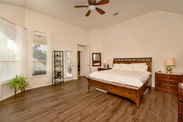 bedroom featuring lofted ceiling, dark hardwood / wood-style floors, and ceiling fan