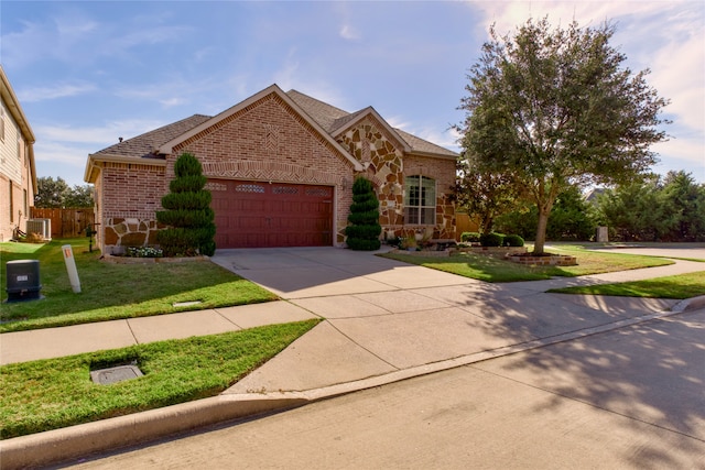 view of front facade featuring a front yard and a garage