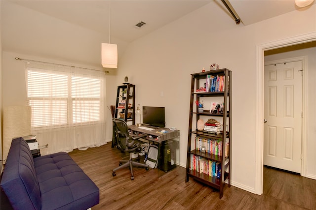 office area with vaulted ceiling and dark hardwood / wood-style flooring