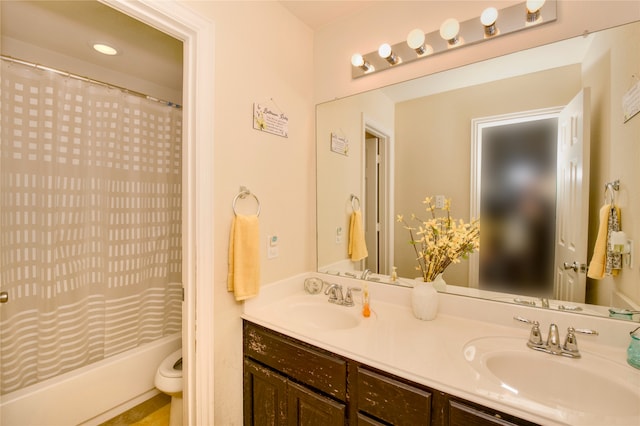 full bathroom featuring vanity, toilet, and shower / bath combination with curtain