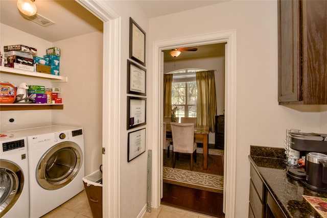 washroom featuring light tile patterned flooring and washer and clothes dryer