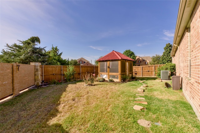 view of yard featuring central air condition unit