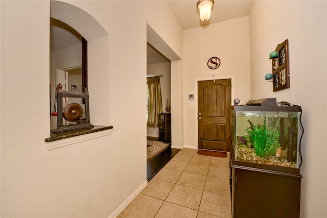 foyer entrance featuring light tile patterned floors