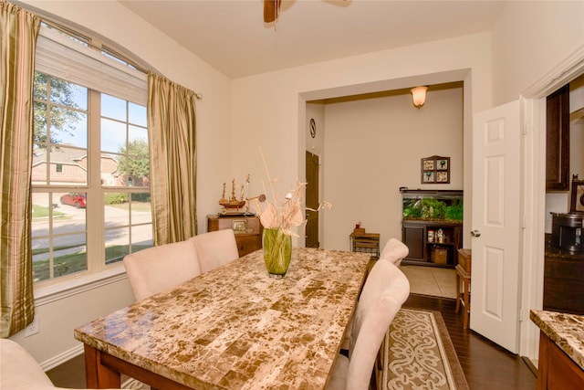 dining area featuring dark hardwood / wood-style floors and ceiling fan