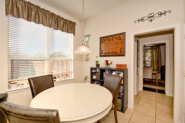 dining room with a healthy amount of sunlight and light tile patterned floors