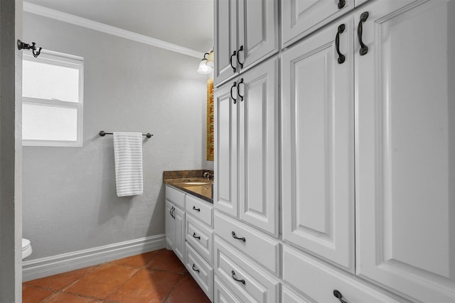 bathroom with crown molding, tile patterned flooring, vanity, and toilet