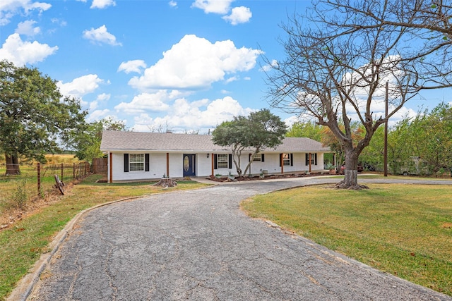 ranch-style house with a front yard