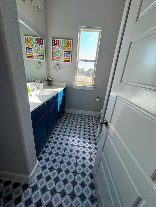 bathroom with vanity and tile patterned floors