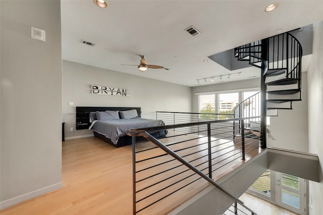 bedroom with hardwood / wood-style floors