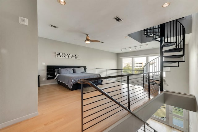 959 W Bluff St Unit 105, Fort Worth, TX 76102 - bedroom featuring baseboards, wood finished floors, and recessed lighting