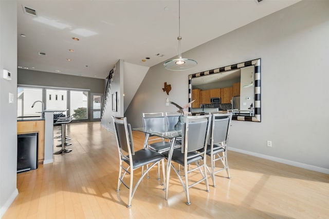 dining room with light hardwood / wood-style flooring