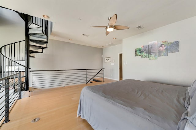 959 W Bluff St Unit 105, Fort Worth, TX 76102 - bedroom with wood finished floors and a ceiling fan