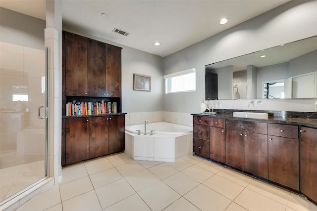 959 W Bluff St Unit 105, Fort Worth, TX 76102 - full bath with vanity, a bath, a shower stall, tile patterned floors, and recessed lighting