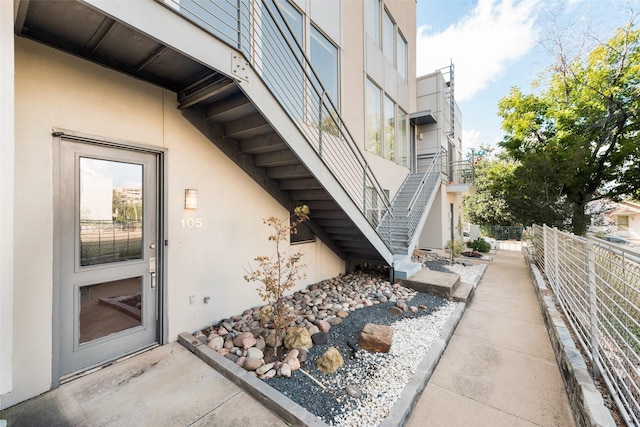 959 W Bluff St Unit 105, Fort Worth, TX 76102 - view of exterior entry featuring stucco siding