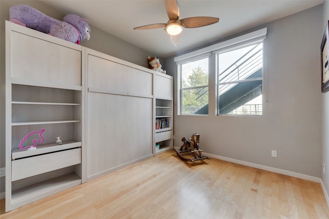 bedroom featuring hardwood / wood-style floors and ceiling fan