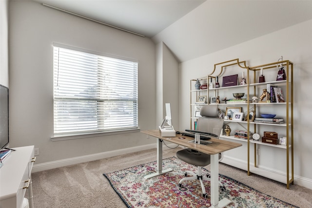 carpeted office space with lofted ceiling