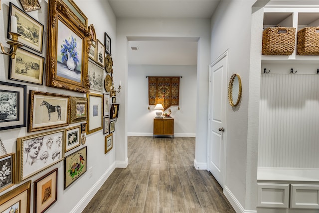 corridor featuring wood-type flooring