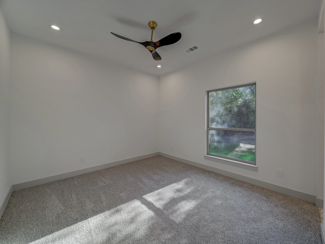 spare room with ceiling fan and carpet floors