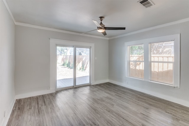 unfurnished room featuring ornamental molding, light hardwood / wood-style flooring, and ceiling fan