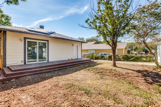 view of home's exterior with a wooden deck