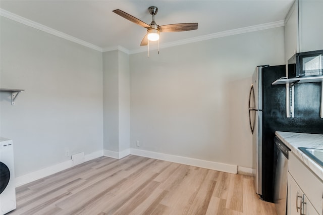 kitchen with ornamental molding, white cabinetry, and light wood-type flooring