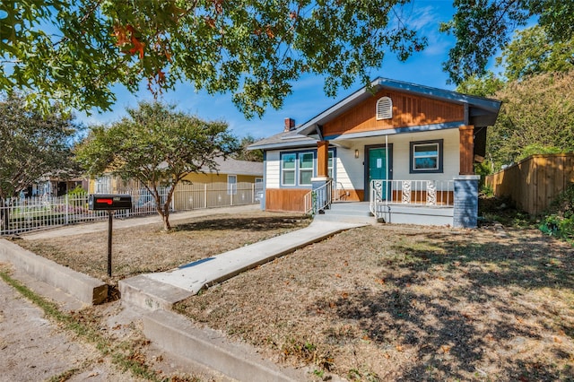 bungalow-style house featuring covered porch