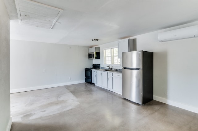 kitchen with appliances with stainless steel finishes, concrete floors, white cabinetry, a wall mounted air conditioner, and sink