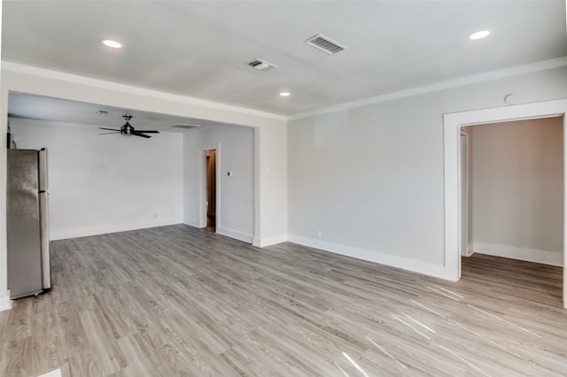 spare room featuring ceiling fan and light wood-type flooring