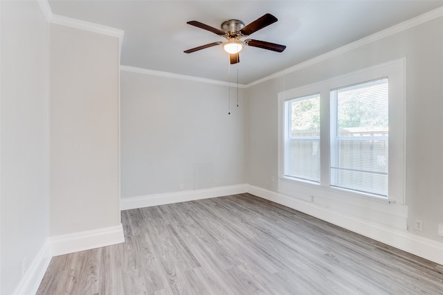 spare room featuring ceiling fan, ornamental molding, and light wood-type flooring