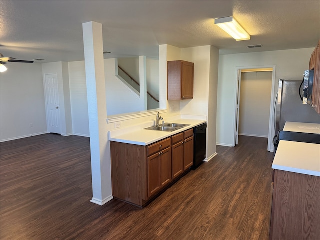 kitchen with black appliances, sink, dark hardwood / wood-style flooring, a textured ceiling, and ceiling fan