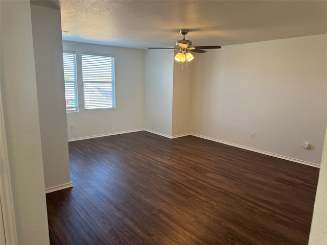 spare room featuring ceiling fan, a textured ceiling, and dark hardwood / wood-style flooring