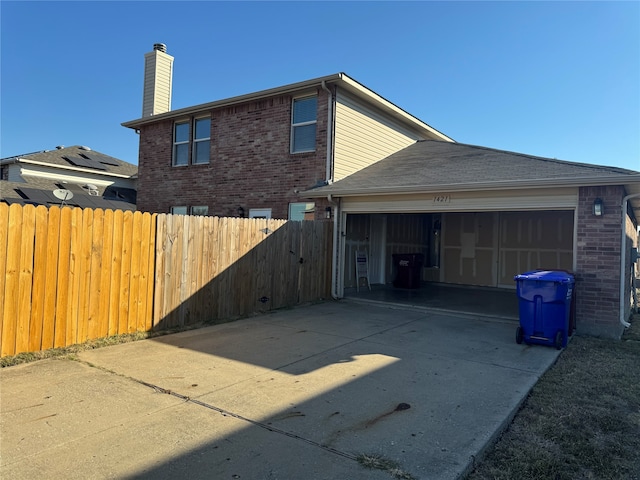 view of property exterior with a garage