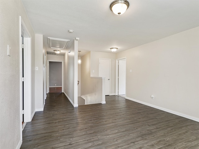 spare room with dark hardwood / wood-style flooring