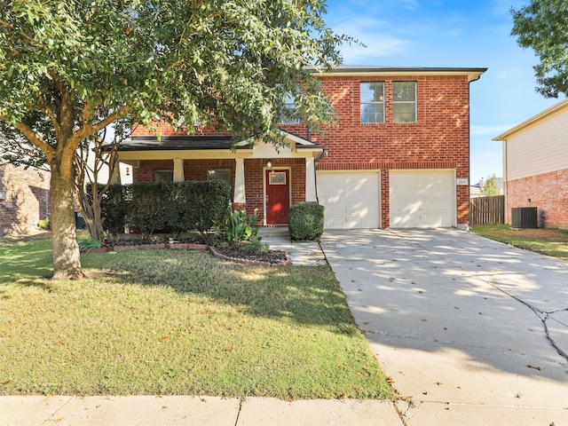 view of front of property featuring a front lawn, central AC unit, and a garage