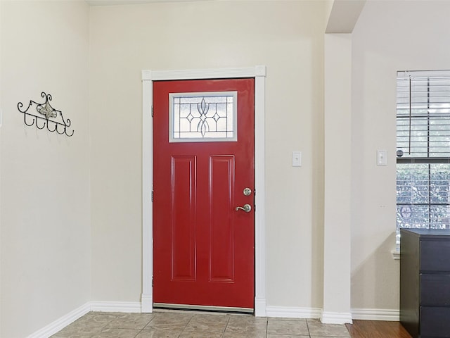 tiled entryway with plenty of natural light