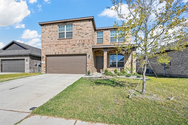 view of front of house with a garage and a front lawn