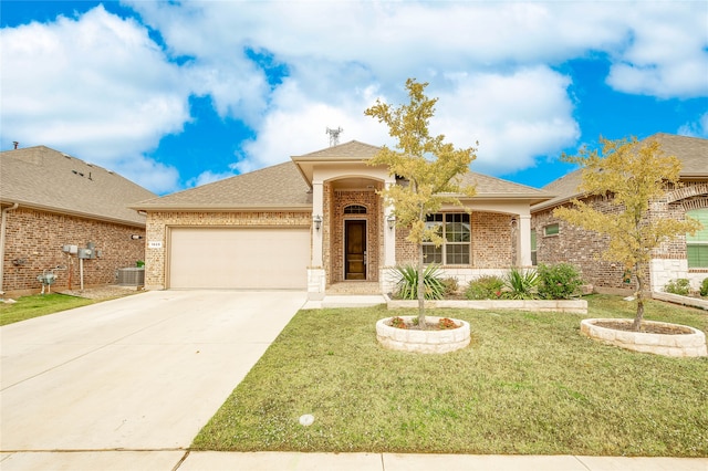 view of front of property featuring a front yard, cooling unit, and a garage