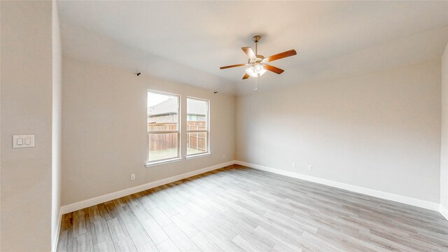 empty room featuring light hardwood / wood-style flooring and ceiling fan