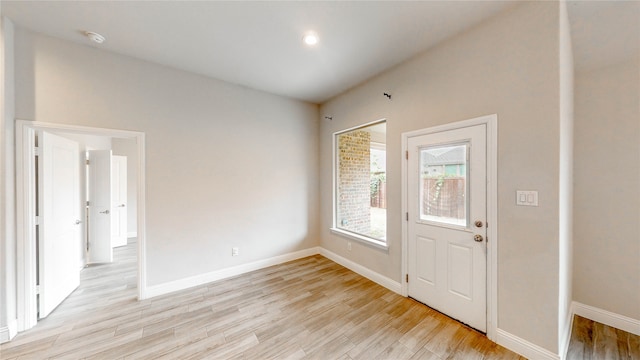 foyer entrance with light wood-type flooring