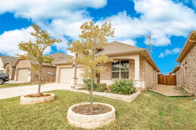 view of front of property featuring a front yard and a garage