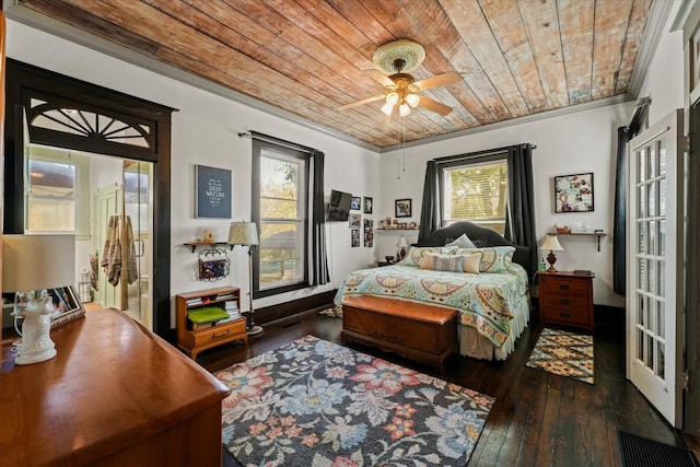 bedroom with dark hardwood / wood-style floors, crown molding, ceiling fan, and wooden ceiling