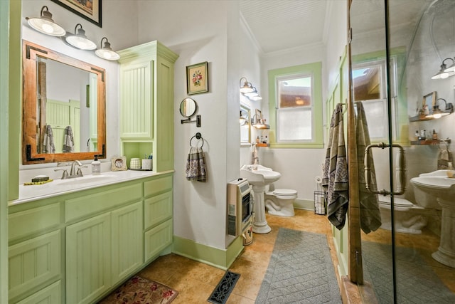 bathroom featuring sink, toilet, ornamental molding, walk in shower, and heating unit