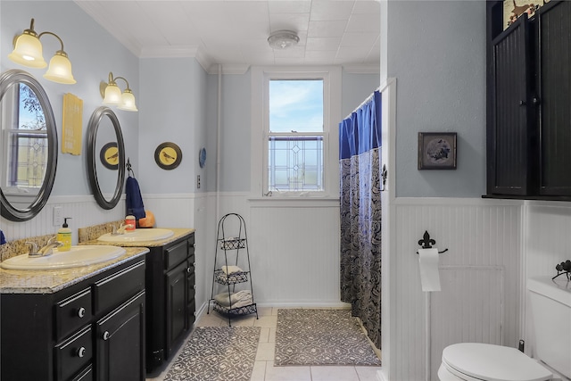 bathroom with vanity, tile patterned floors, toilet, ornamental molding, and curtained shower